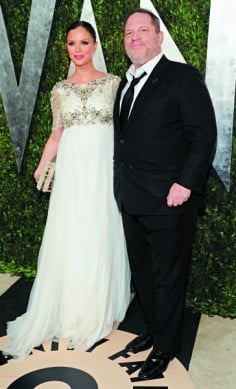 Designer Georgina Chapman, carrying a minaudière adorned with pearls, with her husband Harvey Weinstein at an Oscars after-party. Photo: AP