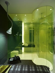 A floor-to-ceiling transparent shower brings openness to a room. Photo: Virgile Simon Bertrand