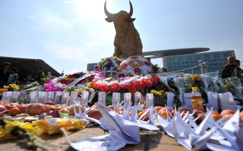 Flowers sit outside the railway station in Kunming. Photo: Xinhua