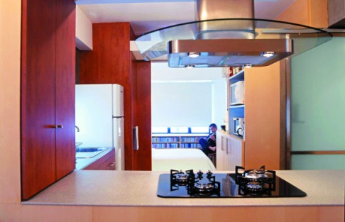 An open kitchen with minimal furnishings are typical of a loft.