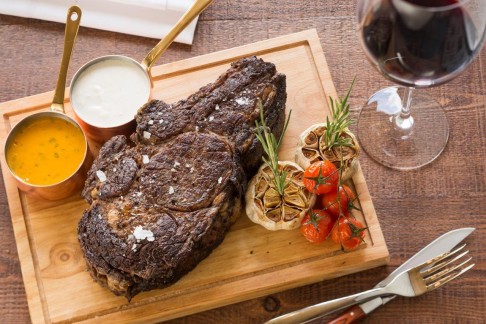 Rib-eye on the bone at Penthouse by Harlan Goldstein