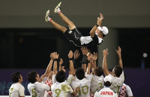 The Japan men's team celebrate after defeating Hong Kong in the final of the Asian Games. Photo: Xinhua