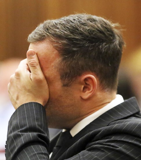 Oscar Pistorius wipes his face during his sentencing hearing at the North Gauteng High Court in Pretoria on  October 14, 2014. Photo: Reuters