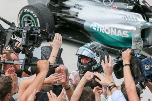 German driver Nico Rosberg greets the spectators after winning the Brazilian Formula One Grand Prix in Sao Paulo. Photo: Xinhua