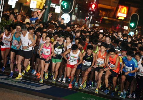 Participants of the half marathon get ready for the start of the race. Photo: K. Y. Cheng