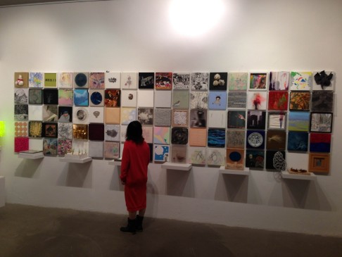 A visitor views the exhibition “In Conversations with 100 Local Artists” at YY9 Gallery.