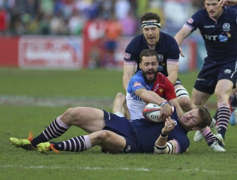 Scotland's Fraser Lyle fights for possession against France standout Terry Bouhraoua.