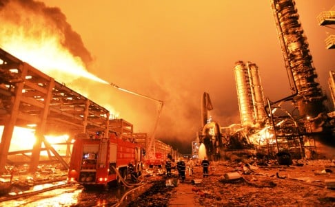 Firefighters try to extinguish a fire at the plant. Photo: Reuters