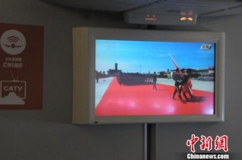 The live broadcast was shown on the Air China aircraft's TV screens as well as passengers' mobile devices. Photo: China News Service