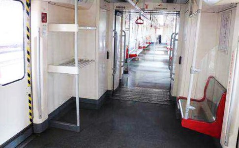 Before Guangzhou Metro Corp removed seating and storage areas at the end of some carriages to provide extra space for rush-hour passengers. Photo: SCMP Pictures