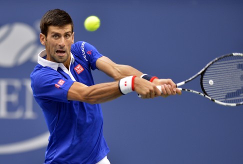 Novak Djokovic returns to Marin Cilic. Photo: Xinhua