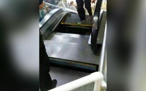 The flooring gave way at the top of the escalator at a Chinese mall on Sunday moments after a woman had stepped on it. Photo: SCMP Pictures