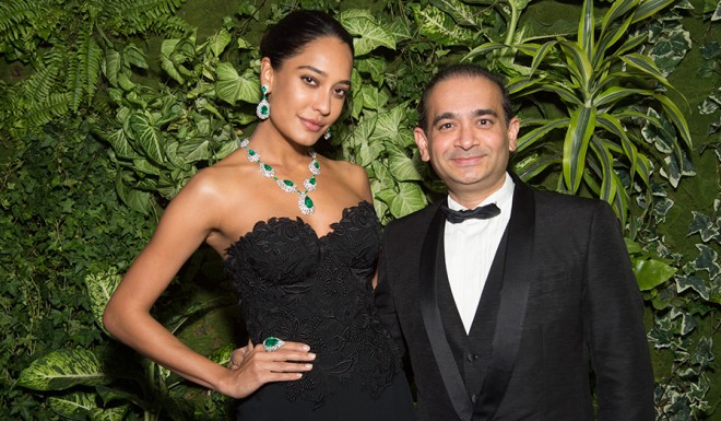 Lisa Haydon wears the Emerald Waterfall Suite featuring bright green Colombian emeralds and Jasmine Cut® diamonds at the La Biennale Paris with Nirav Modi.